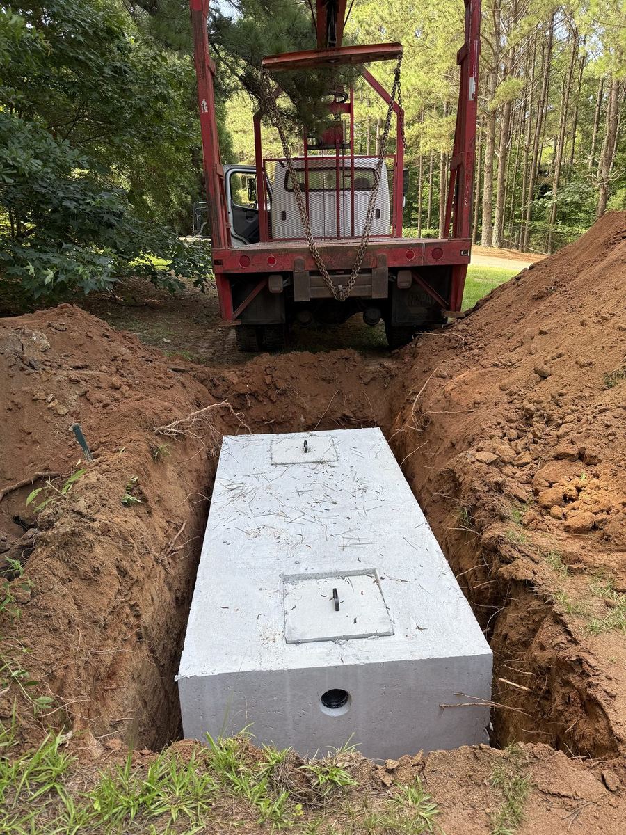 New septic tank installation with skid steer